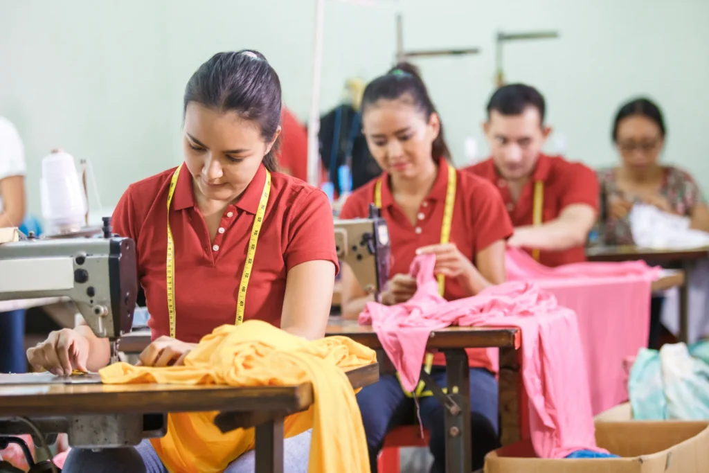 clothing manufacturing: women sewing clothes