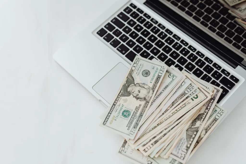 crowdfunding money on laptop computer