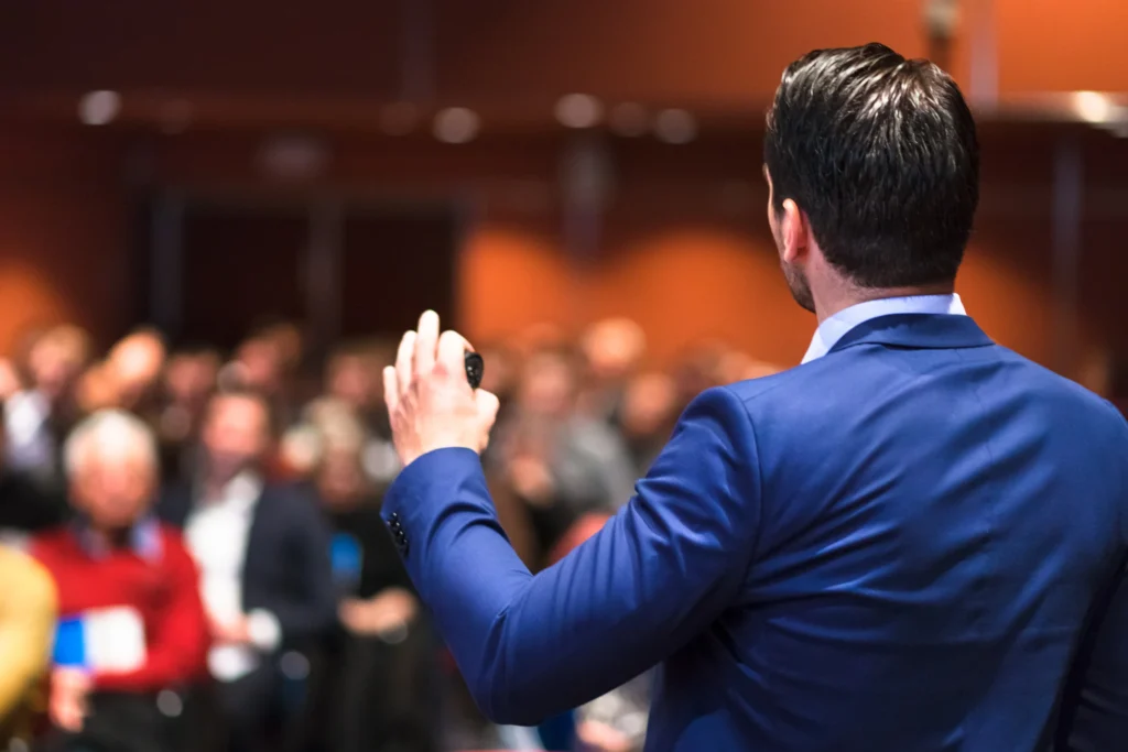 public relations: man presenting at seminar or conference