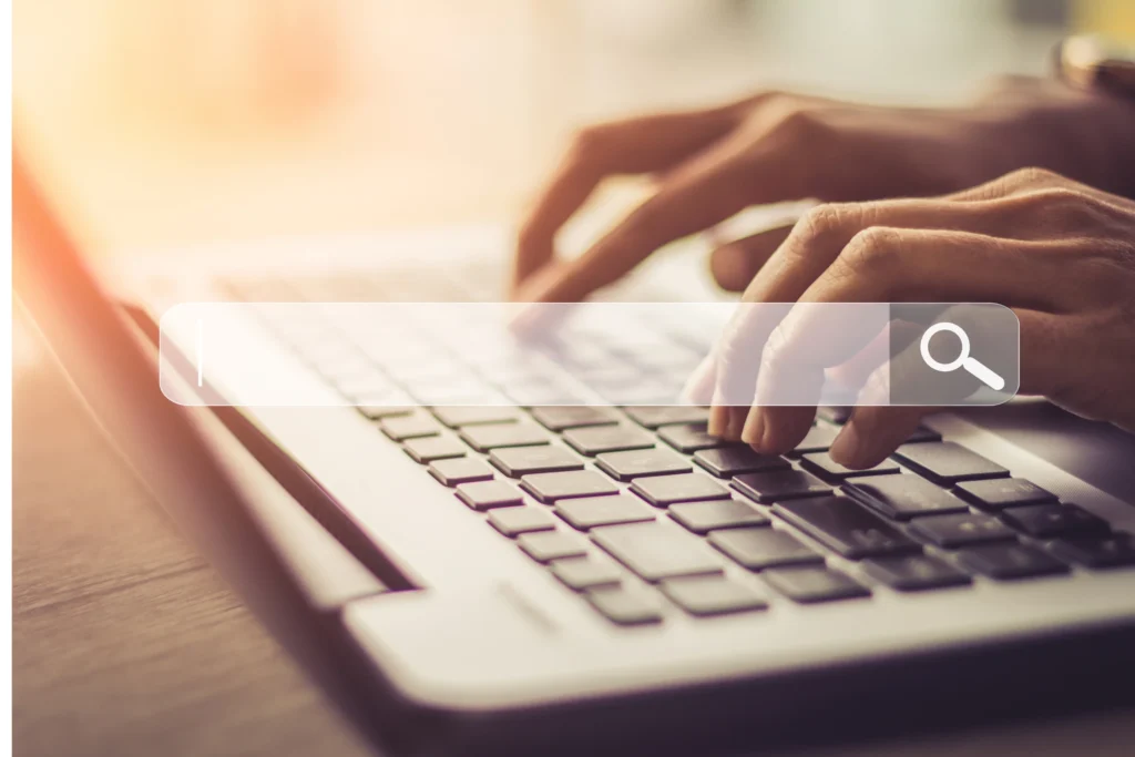 future of seo: man typing on laptop