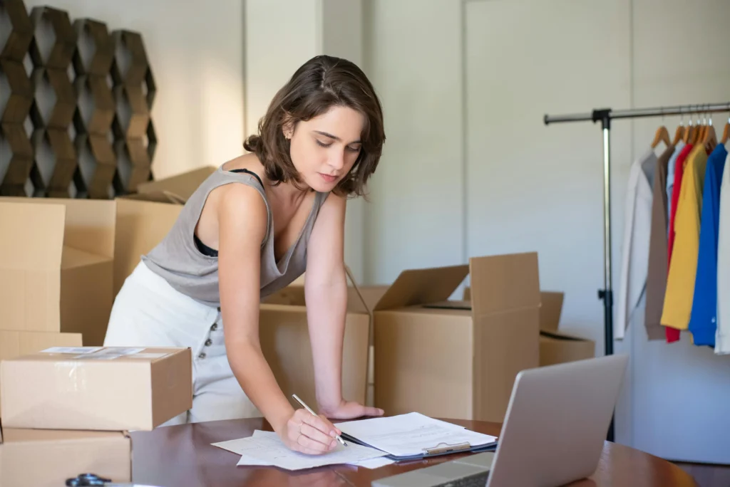 A woman thinking about how moving can expand your business horizons.