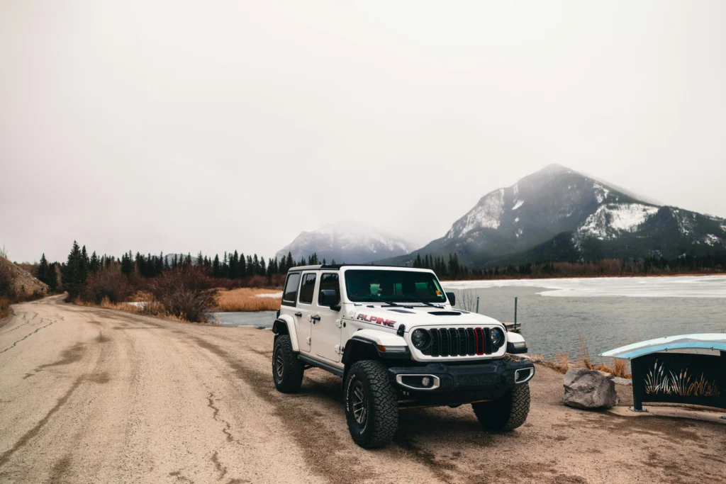 Adventure SUV parked by scenic lake