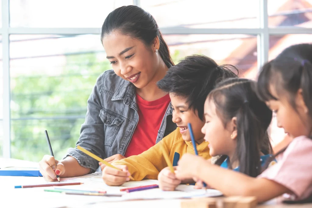 teacher with her students: continuing education for teachers