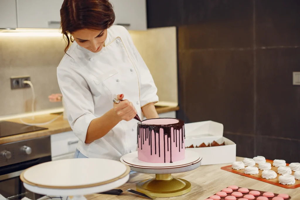 woman baker decorating a cake