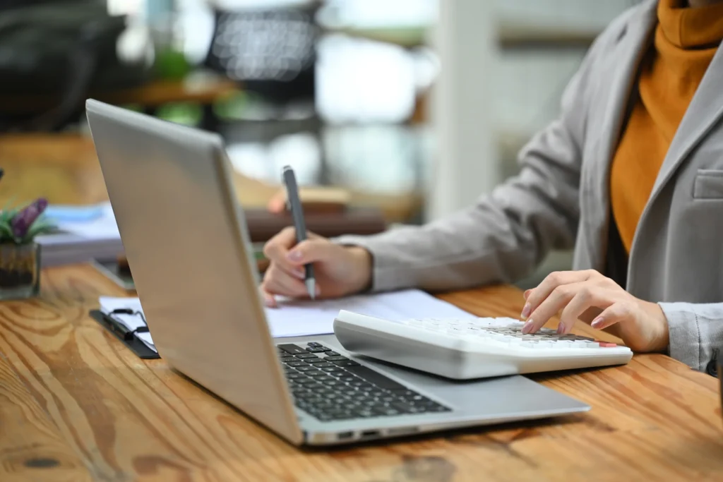 outsource data entry : woman typing in computer