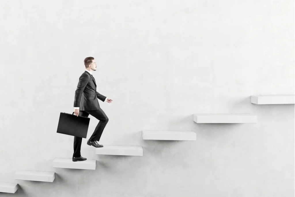 entrepreneur climbing stairs of success