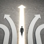 Man choosing path among arrows leading to success