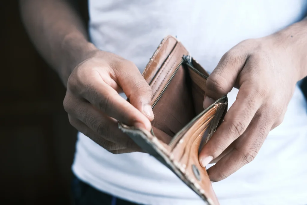man's empty wallet due to debt