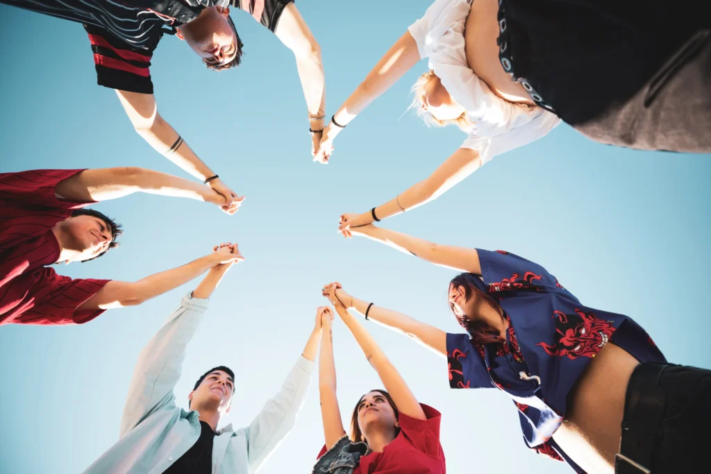 generation z teenagers raising hands