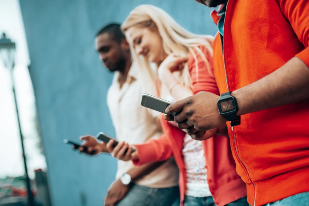 generation z teenagers on their mobile phone